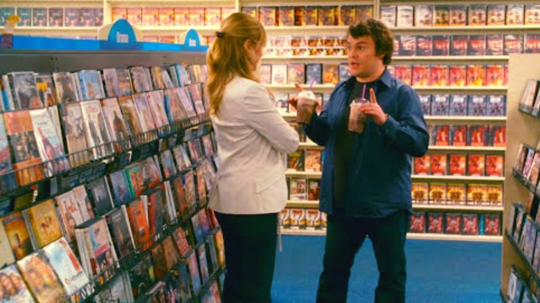 Couple talks in video store