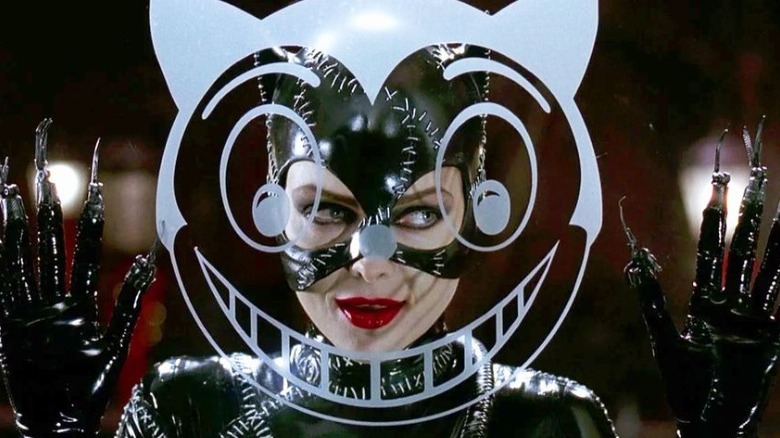 Catwoman poses by window drawing