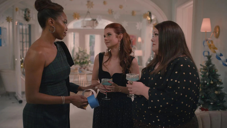 Helen, Maddie, and Dana standing arounf in nice dresses drinking blue drinks in Sweet Magnolias