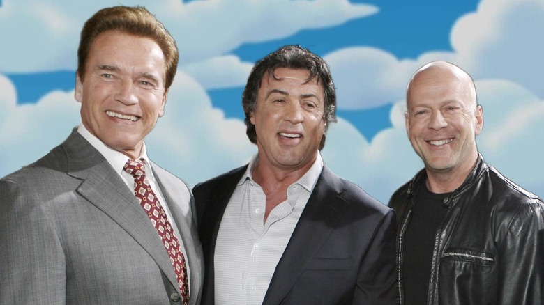 Arnold Schwarzenegger, Sylvester Stallone, and Bruce Willis in front of The Simpsons sky