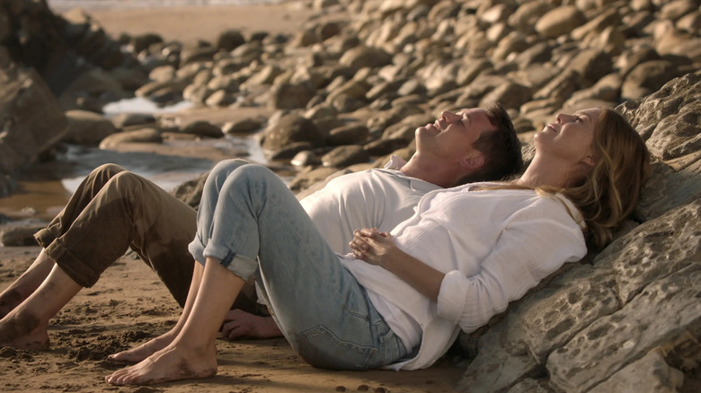 George and Meredith laying on the coma beach in Grey's Anatomy