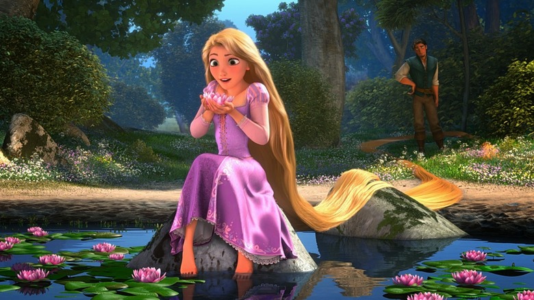 Rapunzel (Mandy Moore) sitting on a rock in Tangled