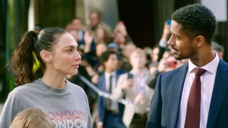 Gal Gadot as Maia Marten shares a moment with Alfred Enoch as Ted in The Runner