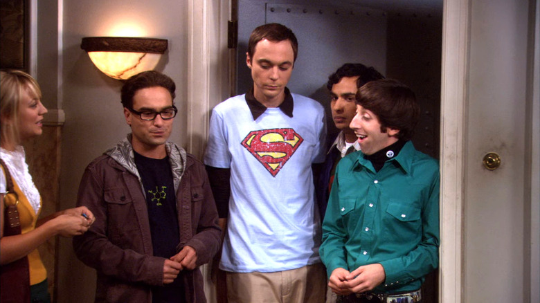 Sheldon standing in his doorway with Penny Leonard Raj and Howard wearing a Superman shirt on The Big Bang Theory