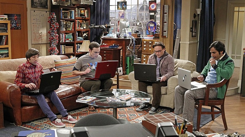 Howard, Sheldon, Leonard, and Raj sitting with their laptops in a circle in The Big Bang Theory