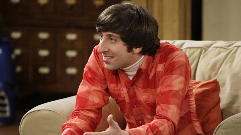 Howard on couch leaning forward Big Bang Theory
