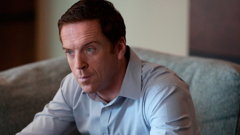 Damian Lewis as Nicholas Brody sitting on a couch in Homeland