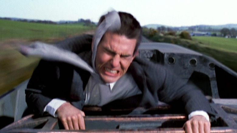 Ethan Hunt (Tom Cruise) getting blasted by wind atop a bullet train in Mission: Impossible