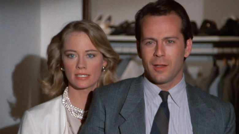 Maddie and David standing in front of a closet in Moonlighting