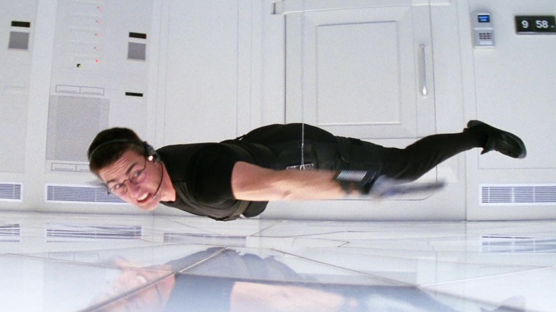 Ethan Hunt dangling above an active floor in Mission:Impossible