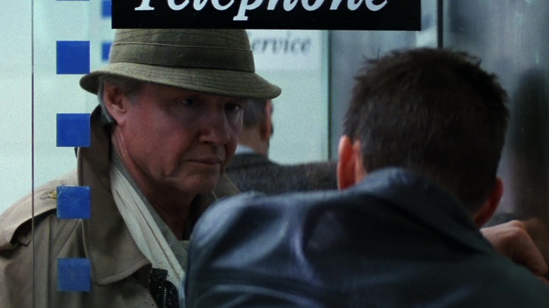 Jim Phelps and Ethan Hunt reuniting at a phone booth in Mission: Impossible