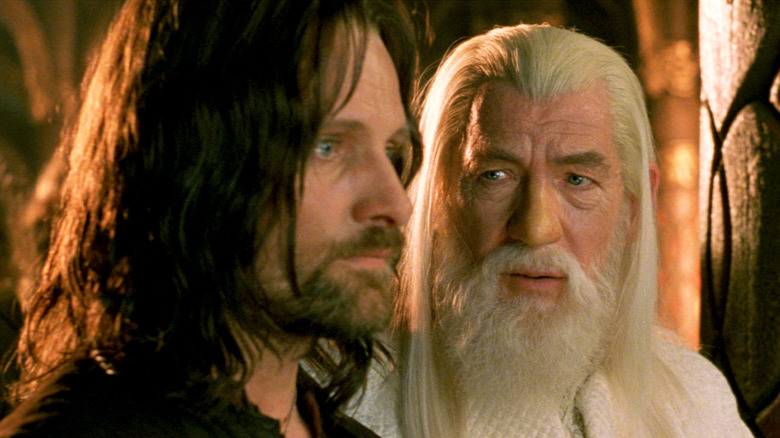 Viggo Mortensen as Aragorn looking straight ahead next to Ian McKellen as Gandalf in The Lord of the Rings: The Return of the King