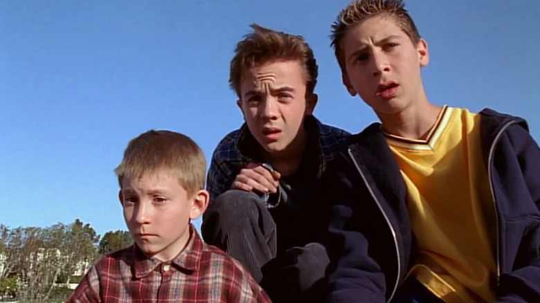 Dewey, Malcolm, and Reese looking concerned outdoors in Malcolm in the Middle