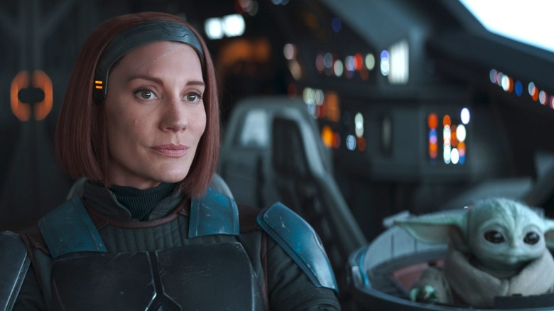 Katee Sackhoff as Bo-Katan Kryze at the controls of a starship alongside