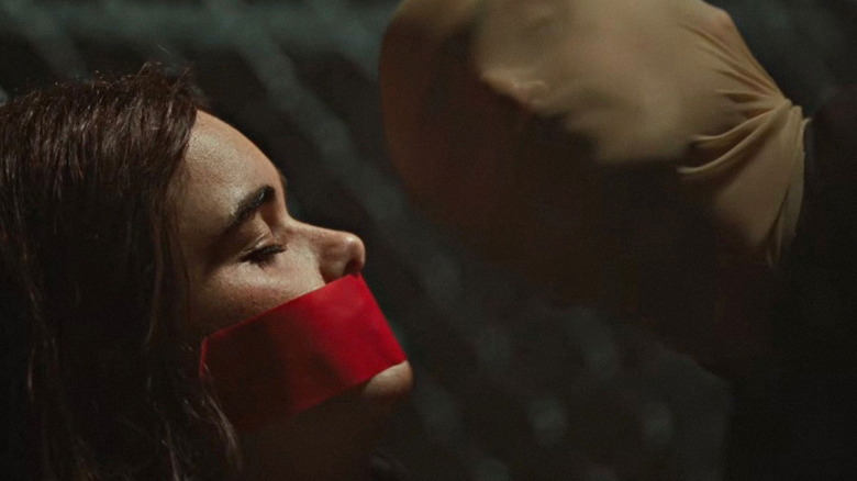 Arthur kidnapping Margot in Faces of Death