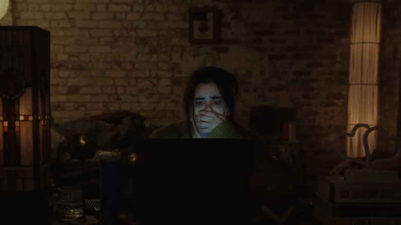 Margot watching horrible footage in Faces of Death