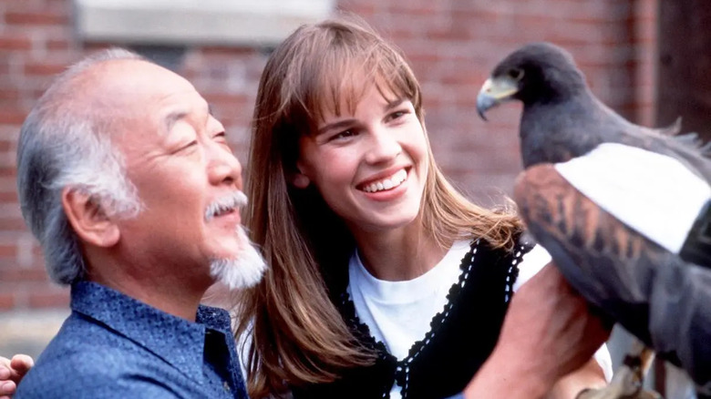 Pat Morita, Hilary Swank, and Angel the Hawk in The Next Karate Kid
