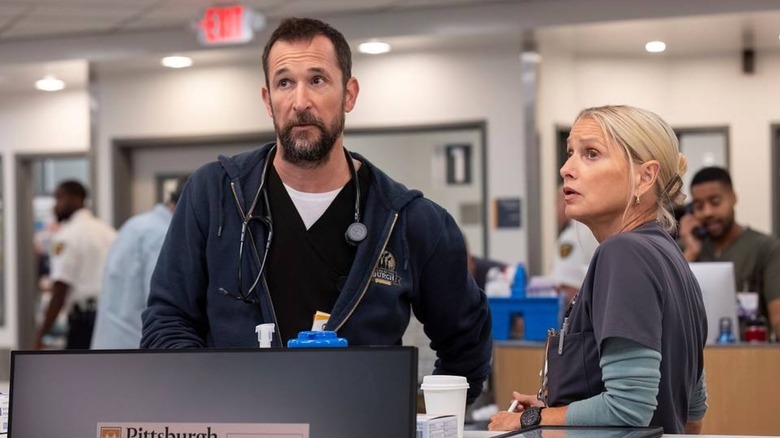 Dr. Robby and Dana behind the main desk in the ER on The Pitt