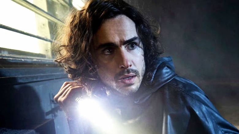 Yorick (Ben Schnetzer) holding a torch on "Y: The Last Man"