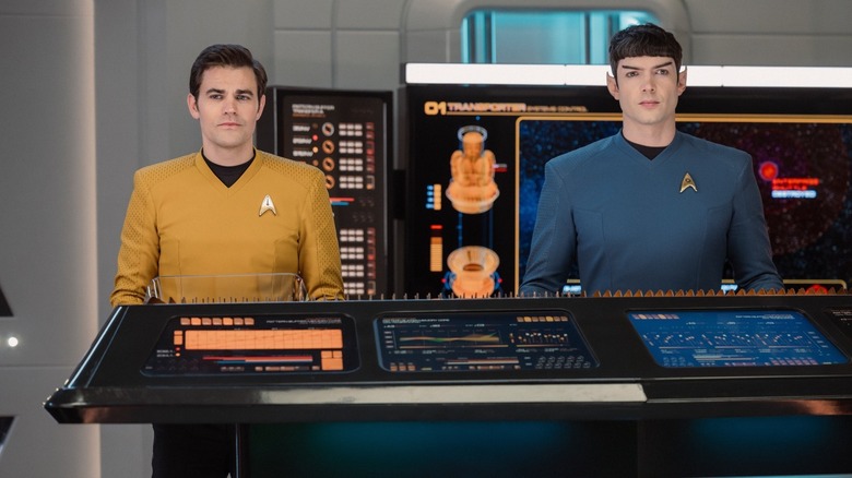 Kirk at Spock at a computer station on Star Trek: Strange New Worlds
