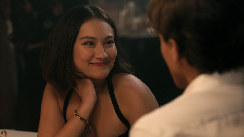 Belly smiling at Conrad at dinner on The Summer I Turned Pretty