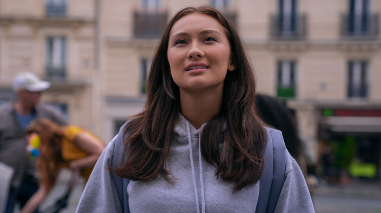 Belly with long hair looking up in wonder in Paris on The Summer I Turned Pretty