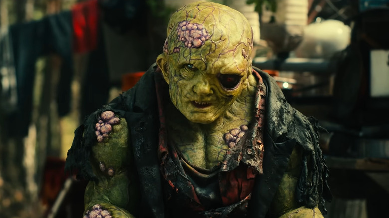 The Toxic Avenger sitting down in The Toxic Avenger (2025)