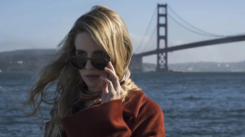 Brit Marling's The OA wearing a red coat and sunglasses on The OA