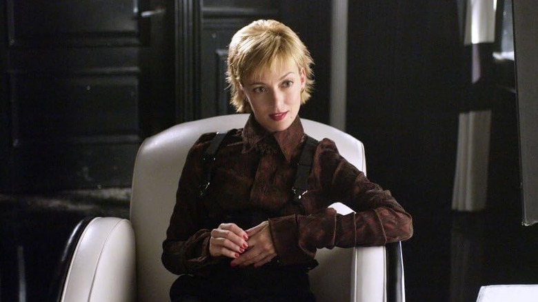 Mia Sarah as Harleen Quinzel sitting in a chair in Birds of Prey