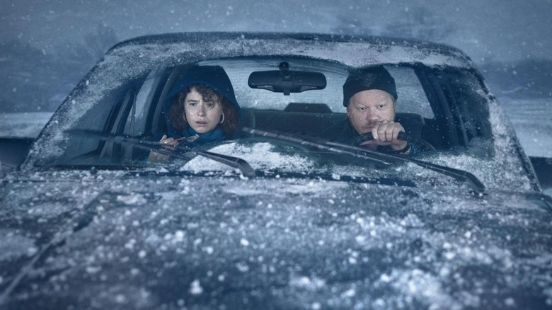 Jake (Jesse Plemons) and the Young Woman (Jesse Buckley) drive through a snowstorm in I'm Thinking of Ending Things (2020)