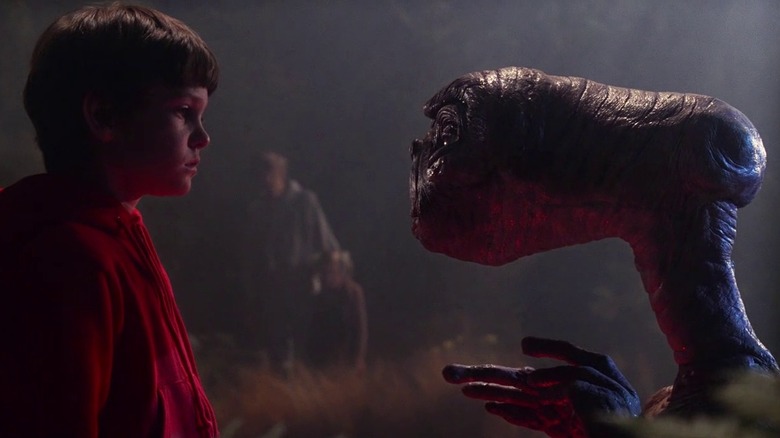 Elliott and E.T. facing each other