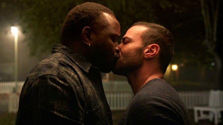Phastos kisses husband tenderly