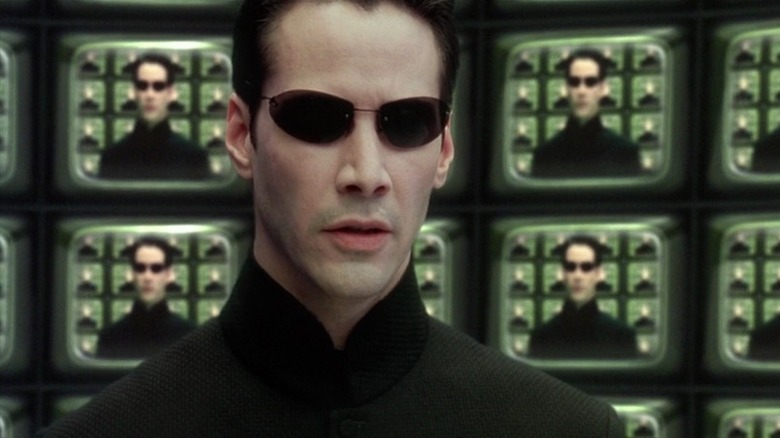 Neo and many television screens