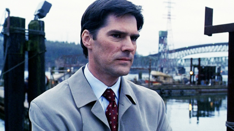 Thomas Gibson's Aaron Hotchner stands outside in Criminal Minds