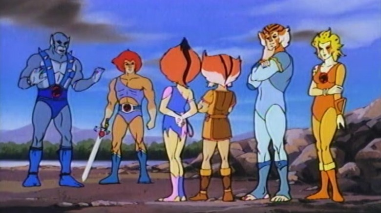 The ThunderCats, standing in a line talking. Lion-O has a sword. From ThunderCats.