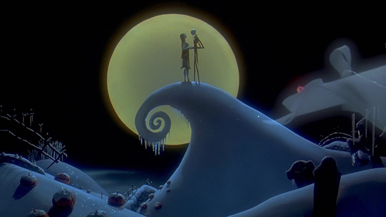 Sally and Jack on a frozen, coily hill with the moon behind them in The Nightmare Before Christmas