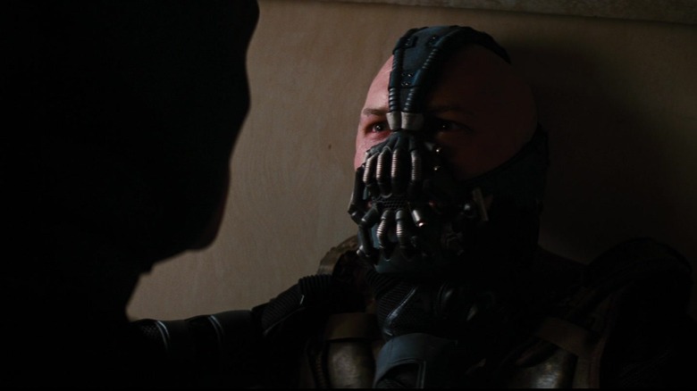 Tom Hardy's Bane looks up at Batman after being incapacitated in The Dark Knight Rises