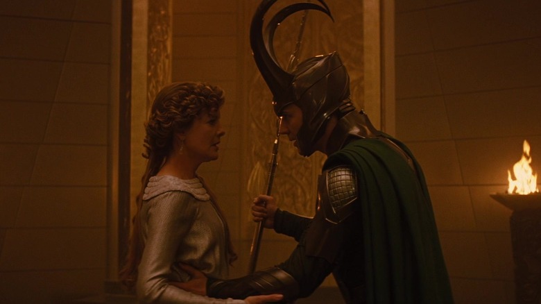 Loki in a big silly helmet talking to Frigga in Thor