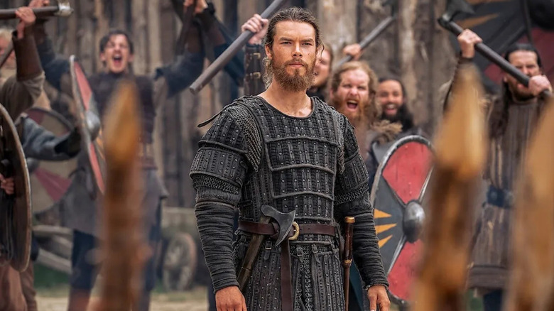 Harald Sigurdson (Leo Sotter) stands at a celebration during the Vikings: Vallala