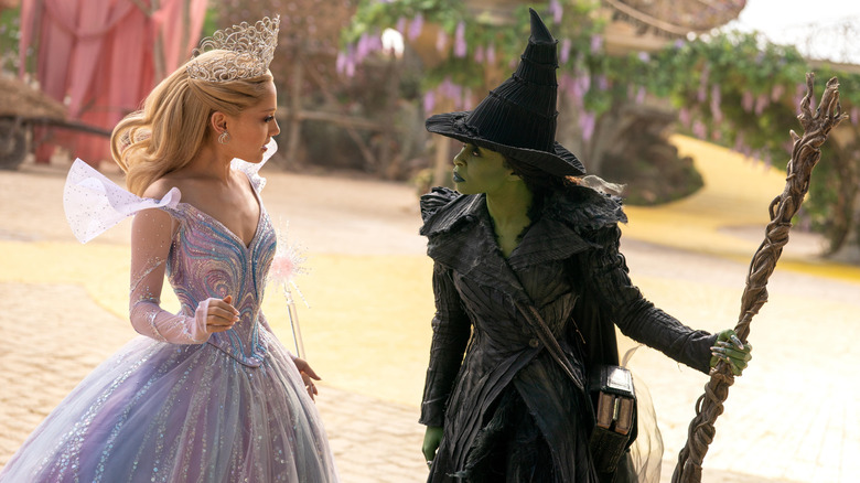 Glinda and Elphaba arguing on the yellow brick road in Wicked: For Good