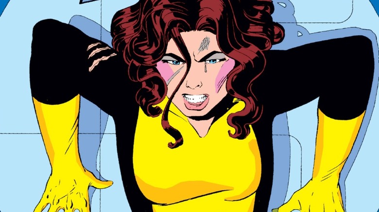 Kitty Pryde backed against a wall on cover of X-Men #168