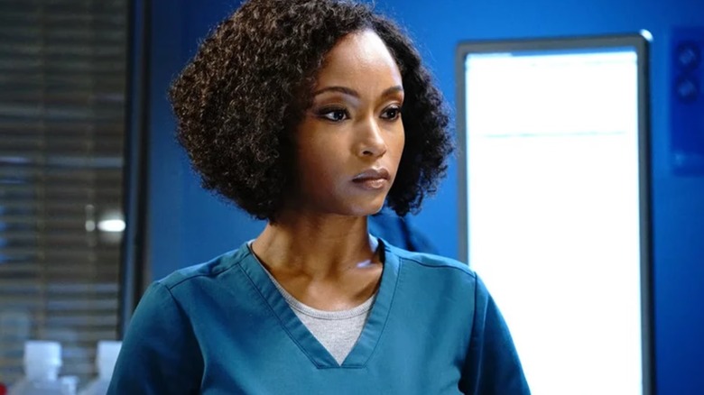 Yaya DaCosta as April Sexton wearing scrubs on Chicago Med