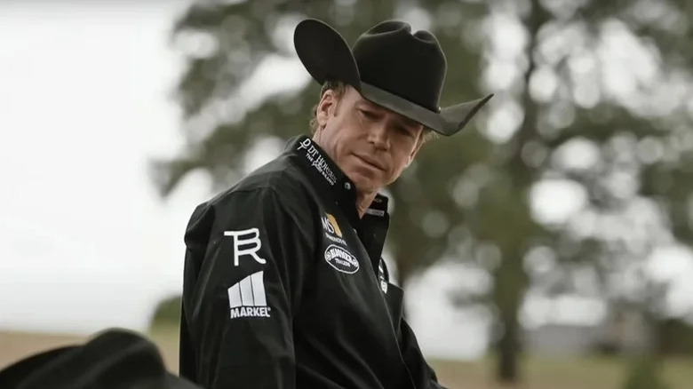Taylor Sheridan as Travis Wheatley looks down as he sits on a horse in Yellowstone