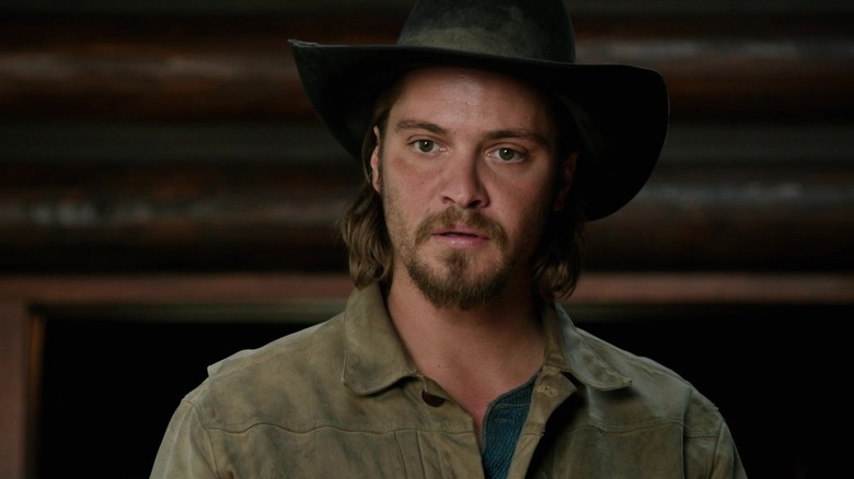 Luke Graims wears a cowboy
