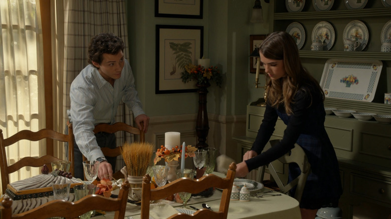 Montana Jordan as Georgie Cooper and Raegan Revord as Missy Cooper setting the table on Georgie & Mandy's First Marriage