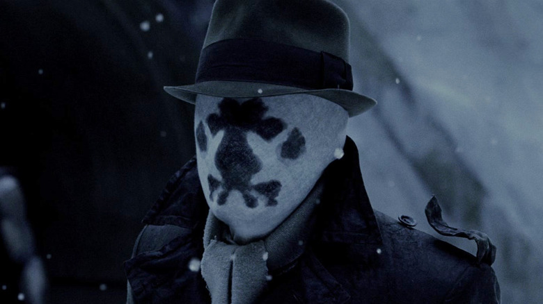 Rorschach standing in the snow in Watchmen (2009)