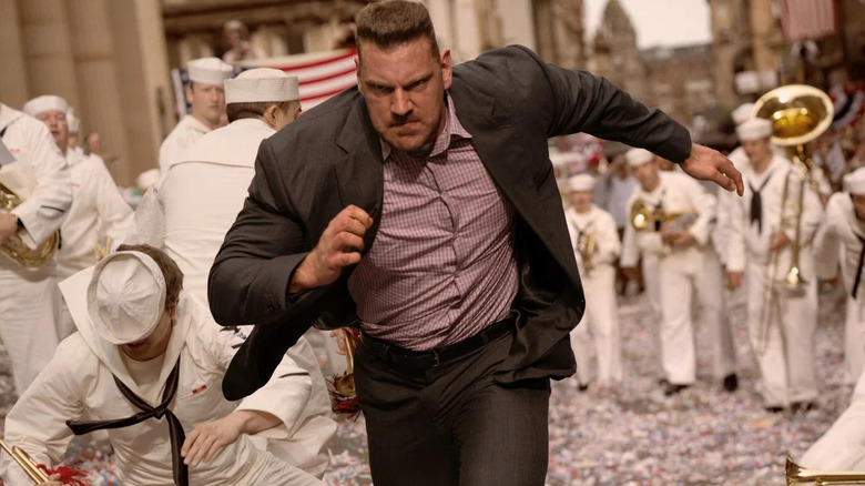 Hauke running past some sailors in Indiana Jones and the Dial of Destiny