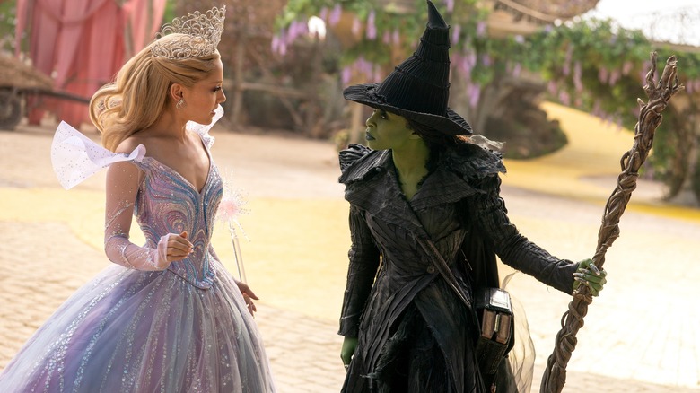 Glinda and Elphaba arguing on the yellow brick road in Wicked: For Good
