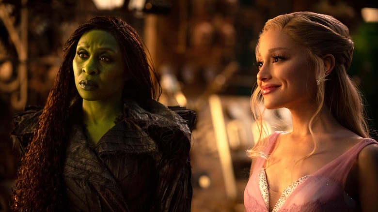 Elphaba and Glinda looking at someone and listening in Wicked: For Good
