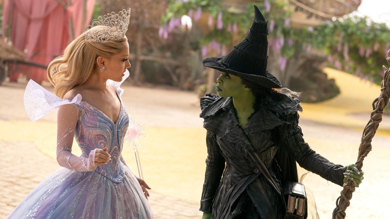 Glinda and Elphaba arguing on the yellow brick road in Wicked: For Good